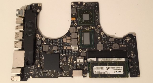 MacBook Pro logic board with reflowed graphics chip and thermal paste removed